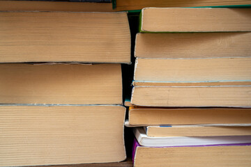 Front close-up view of stacked books and their pages