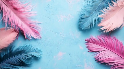 Pink and blue feathers on blue background, flat lay.  Perfect for websites, blogs, or social media.