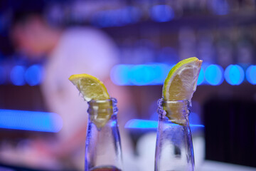 Enjoying Refreshing Beverages with Lime Slices in a Fun and Lively Social Setting