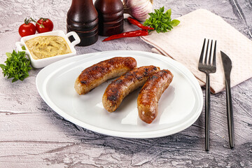Delicous natural roasted sausages in the plate
