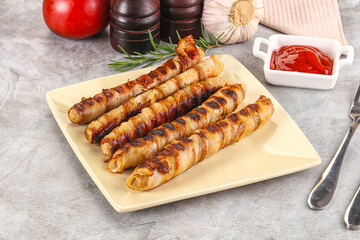 Grilled meat sausages wrapped bacon