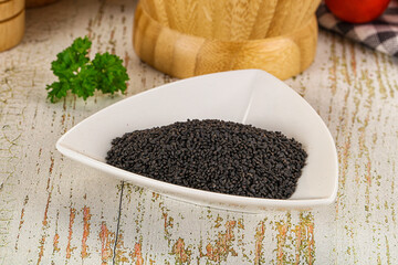 Black dry Nigella seeds in the bowl