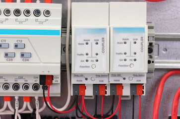 Automation modules controlled via a digital data bus. It is installed in an electric switchboard. Soft focus.