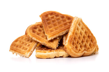 A pile of heart-shaped waffle pieces on a white background, showcasing their golden-brown, crispy texture. The arrangement suggests casual snacking or a broken and shared treat