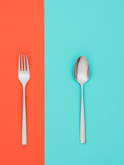 Fork and Spoon on Blue and Red Background Photo