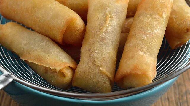 Spring rolls on a plate on table	