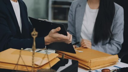 Lawyers provide legal advice. Represent clients in court and help with legal documents expert male lawyer discusses tax documents working in the office at a meeting legal consulting concept