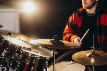 man from behind playing drums at concert