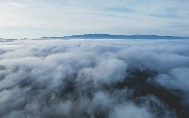 Aerial landscape view of mountains and the sea of fog by drone
