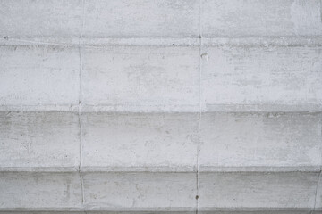 Textured concrete surface with subtle variations in tone captured during daylight