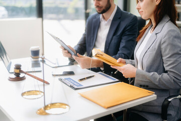 business people and lawyers discussing contract papers sitting at the table. Concepts of law, advice, legal services. in morning light