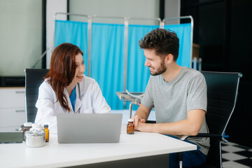 Obraz premium Portrait of female doctor explaining diagnosis to her patient. Doctor Meeting With Patient In Exam Room
