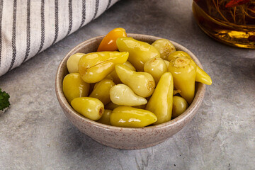 Turkish traditional marinated mini chili peppers