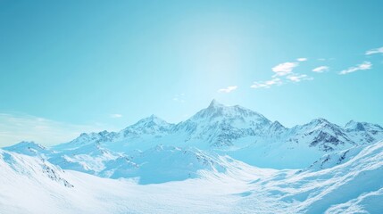 Obraz premium A panoramic view of a snowy mountain range under a bright blue sky, showcasing the majesty of winter.
