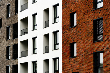 Modern Residential Complex with Mixed Brick and White Facade, Large Windows, and Minimalist Design