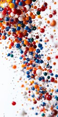 Obraz premium Vibrant multicolored spheres floating against a white background, creating a dynamic and abstract visual effect.