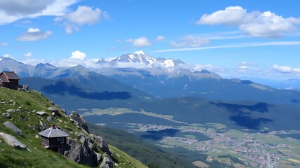 Fototapeta premium Panoramic view of the italian alps showcasing a breathtaking mountain range with two rustic cabins nestled on a verdant hillside.