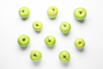 Flat lay composition with green apples on white background
