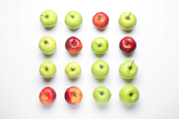 Red and green apples on white background, flat lay