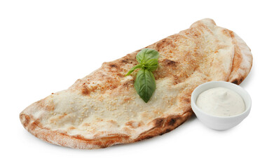 Delicious calzone with sauce and fresh basil isolated on white