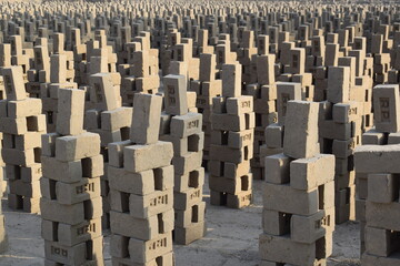 Fototapeta premium manufacturing mud bricks from clay dated 05-01-2025 Bricks are arranged to dry up in the sunlight at the brick production land. Punjab, Adobe bricks made of mud in Peruvian Andes. Material for house
