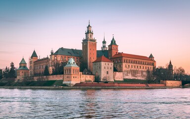Fototapeta premium Krakow's Wawel Castle, Poland Majestic castle on river at sunset.