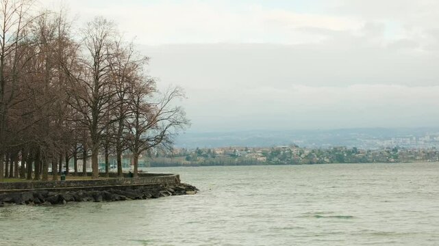 Establishing shot of Morges quay with lake Geneva in Canton of Vaud Switzerland