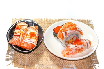 Pictures of salmon sushi served on dish put on white background and isolate Japanese food photo style.