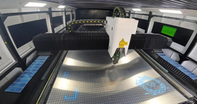 Metal laser cutting machine, close-up. CNC laser machine at the factory. CNC laser cutting machine at work. Cutting metal with a laser CNC machine.