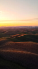 Sunset Symphony Over Rolling Hills: A Dance of Light and Shadow Across Verdant and Golden Fields Under a Painted Sky