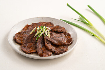 Taiwanese braised beef shank slices in a plate on white table background.