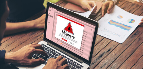 Cyber attacking concept. Malware alert showing on computer screen display scam and threat detection...