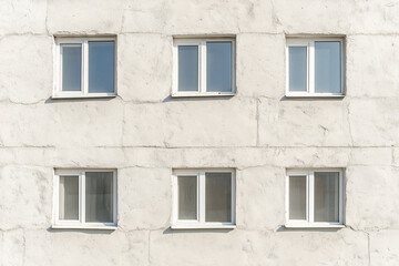 Beige Building Facade with Six Double-Hung Windows