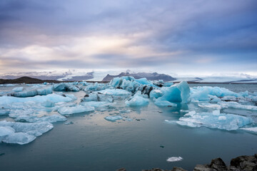 View of the melting glacier on Jokulsarlon or Jökulsárlón Glacier Lagoon, Iceland. Nature, travel, climate change, global warming, winter background, or wallpaper
