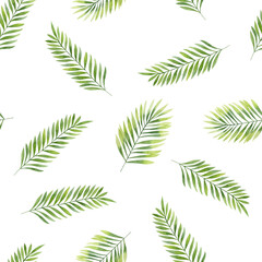 Elegant seamless pattern with tropical leaves painted in watercolor. Delicate green and yellow pattern made of natural motifs.	