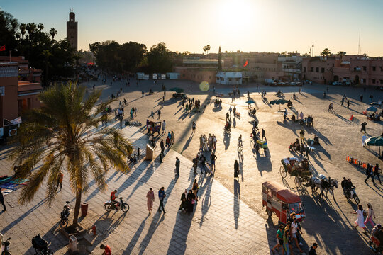 Famous Jemaa El Fnaa square crowded with people at sunset, Marrakesh. Morocco