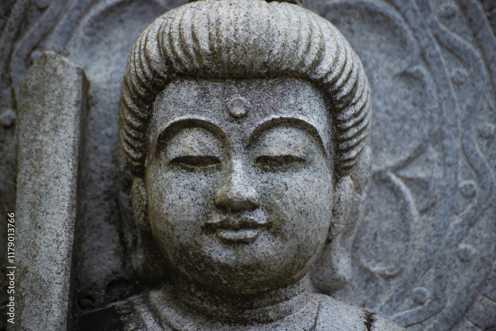 Wall mural A religious stone statue of Manjusri at Japanese buddhism temple