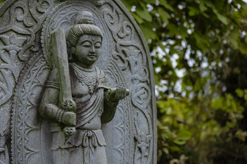 A religious stone statue of Manjusri at Japanese buddhism temple