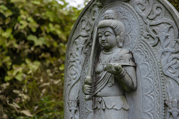 A religious stone statue of Manjusri at Japanese buddhism temple