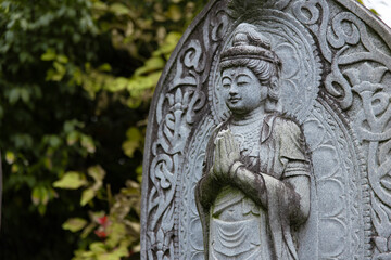 A religious stone statue of Bodhisattva Samantabhadra at Japanese buddhism temple