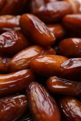 Tasty sweet dried dates as background, closeup