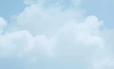 Fluffy white clouds in blue sky