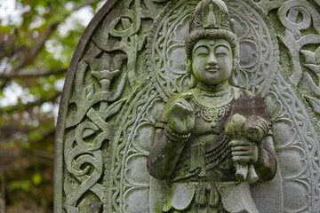 Fototapeta premium A religious stone statue of Mahasthamaprapta at Japanese buddhism temple