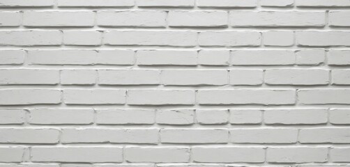 Freshly painted white brick wall with crisp edges and minimal texture for a seamless texture background.

