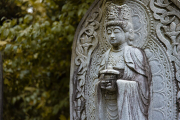 A religious stone statue of Maitreya at Japanese buddhism temple