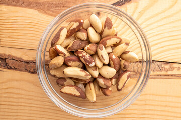 Brazil nut with homemade kitchen utensils, macro, isolated on white background and top view.