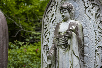 A religious stone statue of Akshobhya at Japanese buddhism temple