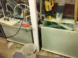 Industrial Chemical Processing System with Liquid Tanks and Pipes