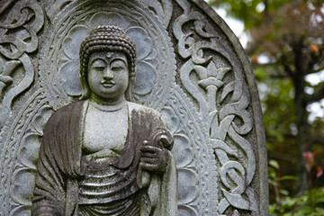 A religious stone statue of Akshobhya at Japanese buddhism temple