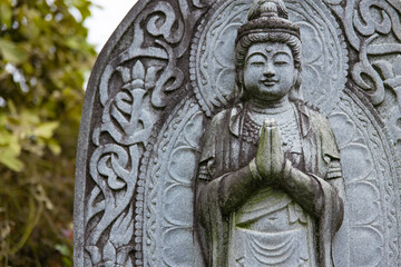 A religious stone statue of Bodhisattva Samantabhadra at Japanese buddhism temple